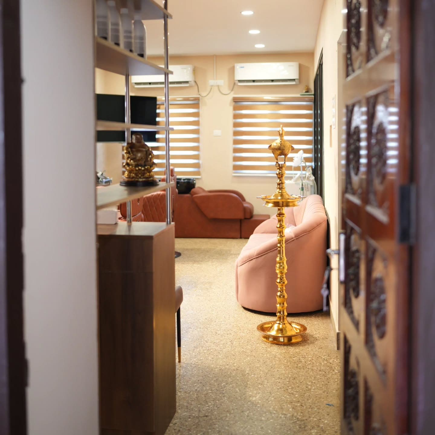 Carved Kerala doorway view into Nilavilakku and lounge