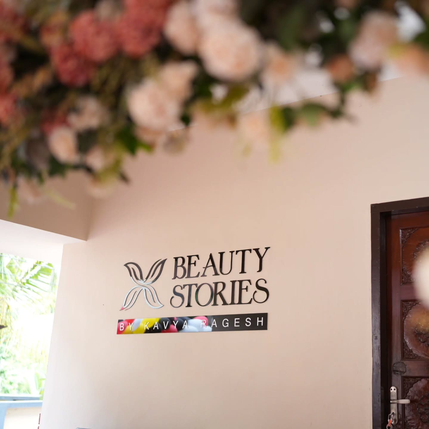 Beauty Stories salon entrance with metallic 3D signage